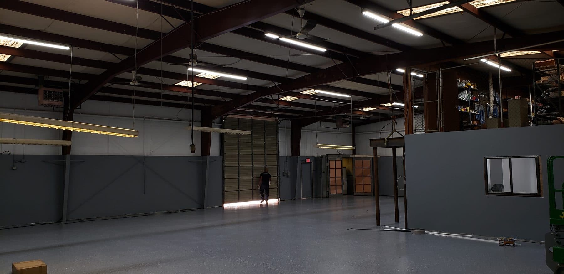 Warehouse with linear slim LED high bays installed over the floor